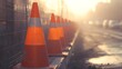 © saychandy - Traffic Cones Lined Up Alongside Construction Site at Sunrise