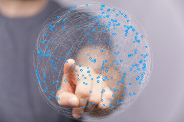Leinwandbilder - Abstract image of a hand interacting with a digital sphere representing global network connections.