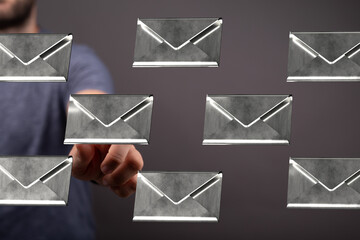 Poster - Hand selecting an email from a digital inbox, showcasing email management and communication.