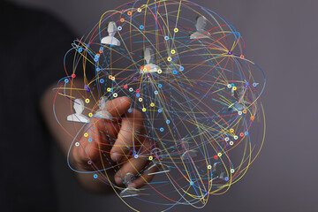 Leinwandbilder - Abstract image of a hand interacting with a digital network sphere. Represents global connection, communication, and networking.