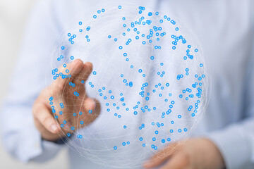 Leinwandbilder - Abstract image of a hand interacting with a digital globe, representing global network connection and data visualization.