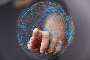 Leinwandbilder - Abstract image of a hand interacting with a digital sphere representing global network connections and data visualization.