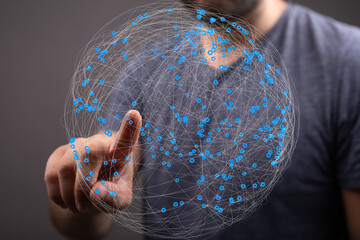 Leinwandbilder - Person interacting with a digital globe, representing global network connections and data visualization.