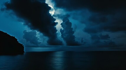 Wall Mural - full moon shining through clouds over ocean