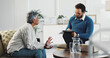 © LuxeShutter24/peopleimages.com - Counseling, conversation and notes of therapist with patient in office for diagnosis or healing. Clipboard, mental health or therapy with counselor man and woman in session for consulting or support