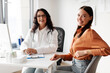 © Home-stock - Portrait of happy lady patient sitting at doctor's office, enjoying quality medical services in clinic, female therapist in uniform sitting at desk