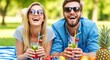 © Pixel Spark - Smiling couple enjoying refreshing drinks on summer picnic