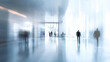 © zhikun sun - Blurred motion of people walking in a modern office hallway
