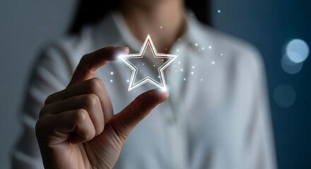 Wall Mural - Woman Hand Holding Glowing Star Shape Illustrating Concept Of Success And Achievement