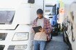 © Serhii - portrait African American men happy Smiling confident positive standing near lorry