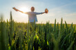 © DusanJelicic - Happy farmer is holding a hat and a tablet while enjoying the sunset over a beautiful green wheat field, expressing freedom and success in agriculture