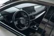 © standret - Steering wheel, front part. Detailed close up view of modern car interior