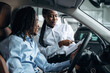 © standret - Trying the feel of vehicle. Man and woman are in the automobile
