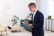 © New Africa - Real estate appraisal. Inspector with clipboard conducting property valuation at home. Space for text