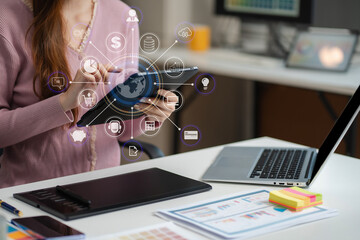 female coder or developer working using a tablet and computer display in problem solving at workplac