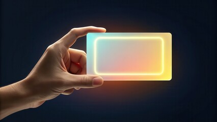 Fototapete - A hand holds a glowing, translucent rectangular card emitting blue and yellow light against a dark background.