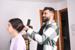 © Antonio Recena - Father combing his daughter's hair at home to get ready for school