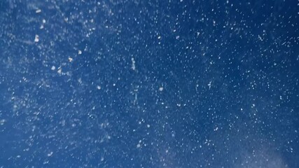 Wall Mural - snow drop from sky, infinity loop for video background, blue sky