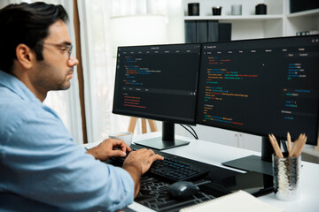 Smart IT developer working software development coding with creating application program update version online website on data's company system two computer code pc screen at modern office. Surmise.