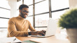 © Prostock-studio - Office Work Concept. Smiling black businessman working on laptop in modern office. Panorama, free space