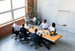 © Prostock-studio - Successful Business Team. Businesswoman Holding Charts Showing Company Growth To Colleagues During Corporate Meeting In Modern Office.