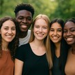 © Prime path 515 - Diverse group of happy young people standing together in park, smiling with unity and friendship, representing inclusion, togetherness, and multicultural harmony outdoors