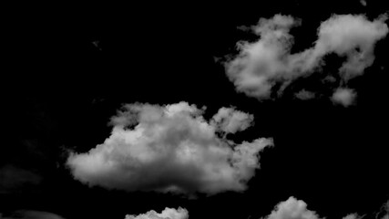 Wall Mural - Time-lapse of separate white clouds on a black background shows real clouds.