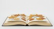 © Svetlana Kulakova - Open book with dried leaves arranged on the pages creating a natural aesthetic with copy space with copy space