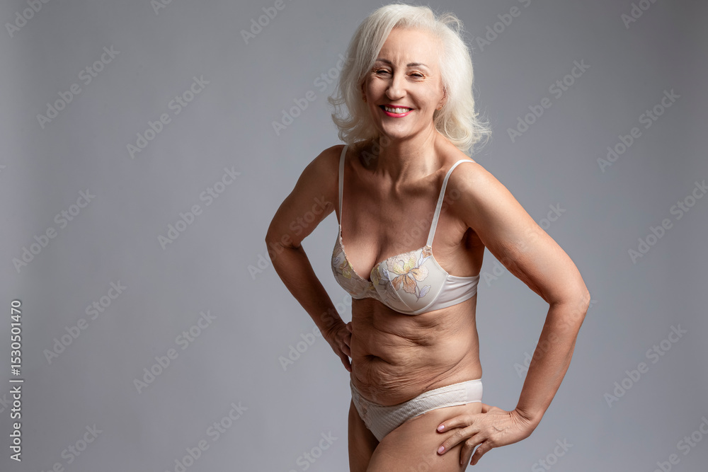Elderly Females Concepts. Smiling Laughing Winsome Calm Positive Mature  Confident Caucasian Woman in White Lingerie With Hands Lifted Over White  Stock Photo | Adobe Stock