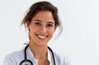 © Iryna - Confident young hispanic female doctor smiling with stethoscope