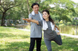 © Natee Meepian - Couple enjoying outdoor fitness together in a park