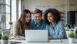 © kaowsar - Diverse team collaborating on laptop in modern office