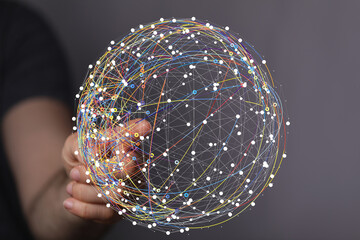 Poster - Hand interacting with a digital sphere, visualizing global network connections and data flow.