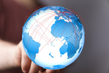 Poster - Stunning image of a hand holding a digital globe, showcasing global interconnectedness.