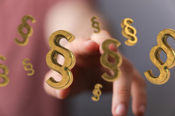 Aufkleber - Abstract image of a hand interacting with floating paragraph symbols, representing legal concepts and law.