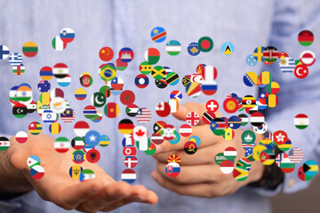 Poster - Image of hands holding various national flags, representing global connection and international relations.