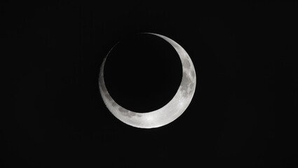 Wall Mural - close up of a studio reconstruction of the eclipse utilizing a bright flashlight, a round cap, and a