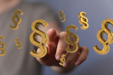 Aufkleber - Abstract image of a hand interacting with floating paragraph symbols, ideal for legal or law related concepts.