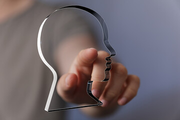 Poster - Abstract image of a hand interacting with a digital head profile, symbolizing AI, technology, or mental health.