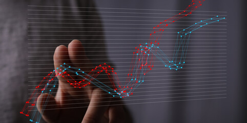 Leinwandbilder - Stock photo of a hand interacting with a digital graph showing upward trends and data analysis.