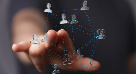 Aufkleber - Hand interacting with a digital network of people, symbolizing connection and teamwork.