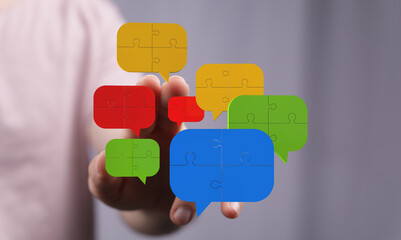Poster - Colorful puzzle pieces forming speech bubbles symbolize communication, collaboration, and teamwork.