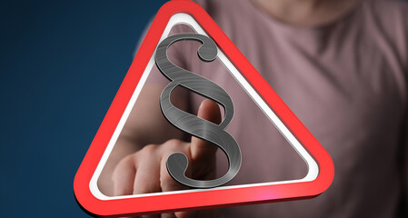 Aufkleber - Stock photo of a hand pointing at a digital red triangle warning sign with a paragraph symbol.  Perfect for legal, law, and regulation concepts.
