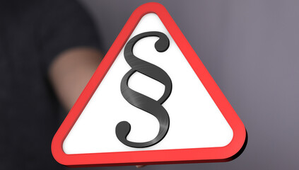 Aufkleber - A hand holds a red triangle warning sign with a black paragraph symbol.  Perfect for legal, law, or warning concepts.