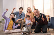 © Hip.hub - Family gathers in living room to celebrate with joy and laughter during a special moment together