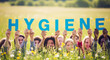 © Inspire Shots Hub - Diverse group of people in grassy field holding letters forming word 'Hygiene', showcasing importance of cleanliness and health awareness