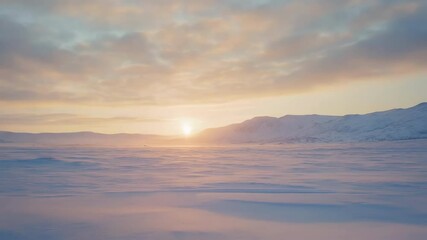 Wall Mural - soft golden rays warming snow blanketed plains, casting pastel hues across distant mountain ranges a