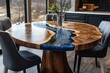 © Michael - Luxurious round wooden table with blue epoxy resin filling resembling a river flowing across the surface, placed in a stylish dining area