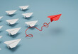 © Pixel Studio - Red paper airplane leading the way concept of leadership and innovation for business strategy success