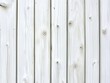 © Pen - Close-up view of a white painted wooden plank fence.  Vertical, even planks, showing wood grain and knots.  Light and bright